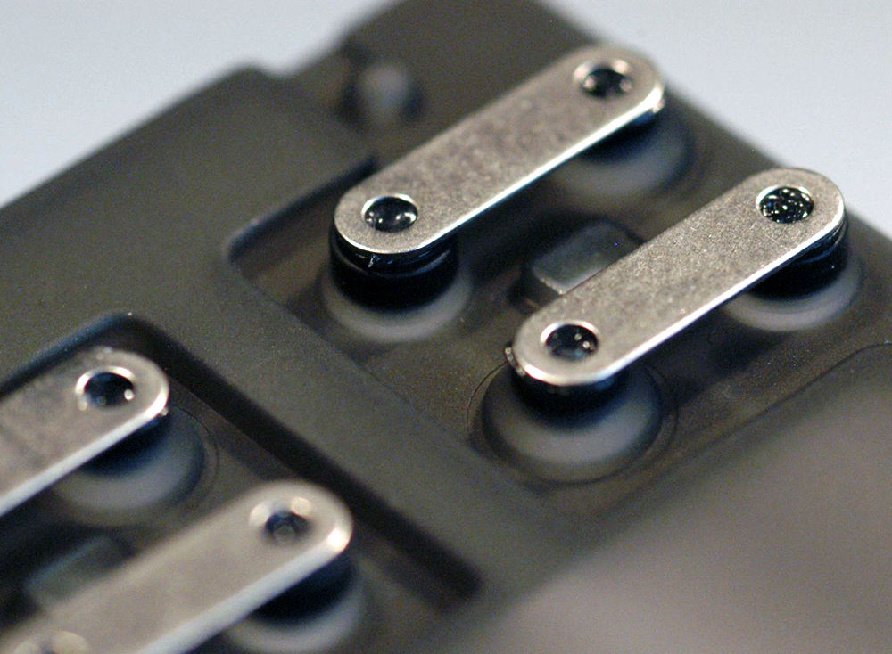 Metal plate rocker to create a double dent switch